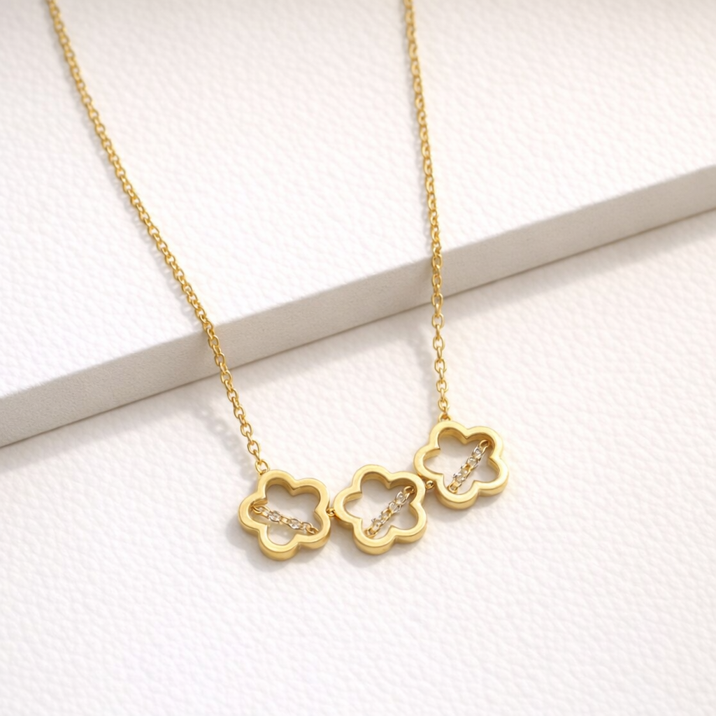 Gilded Trio: Triple Bloom Floral Necklace in Polished Gold-Tone