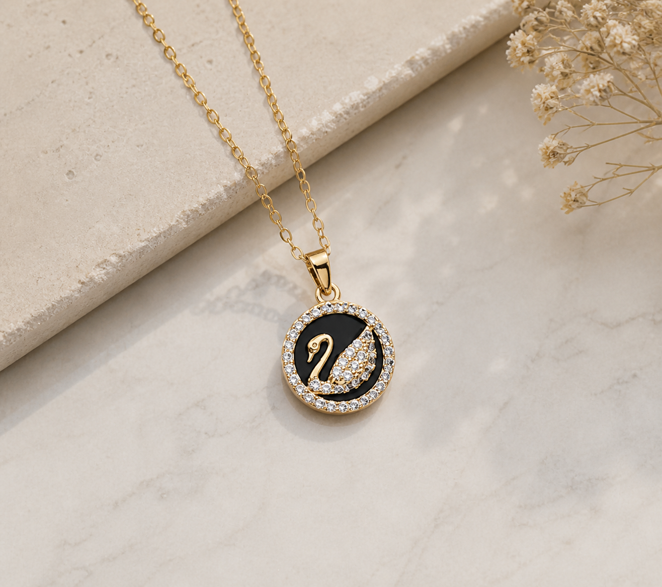 Midnight Grace: Crystal-Pavé Swan Medallion in Polished Gold-Tone