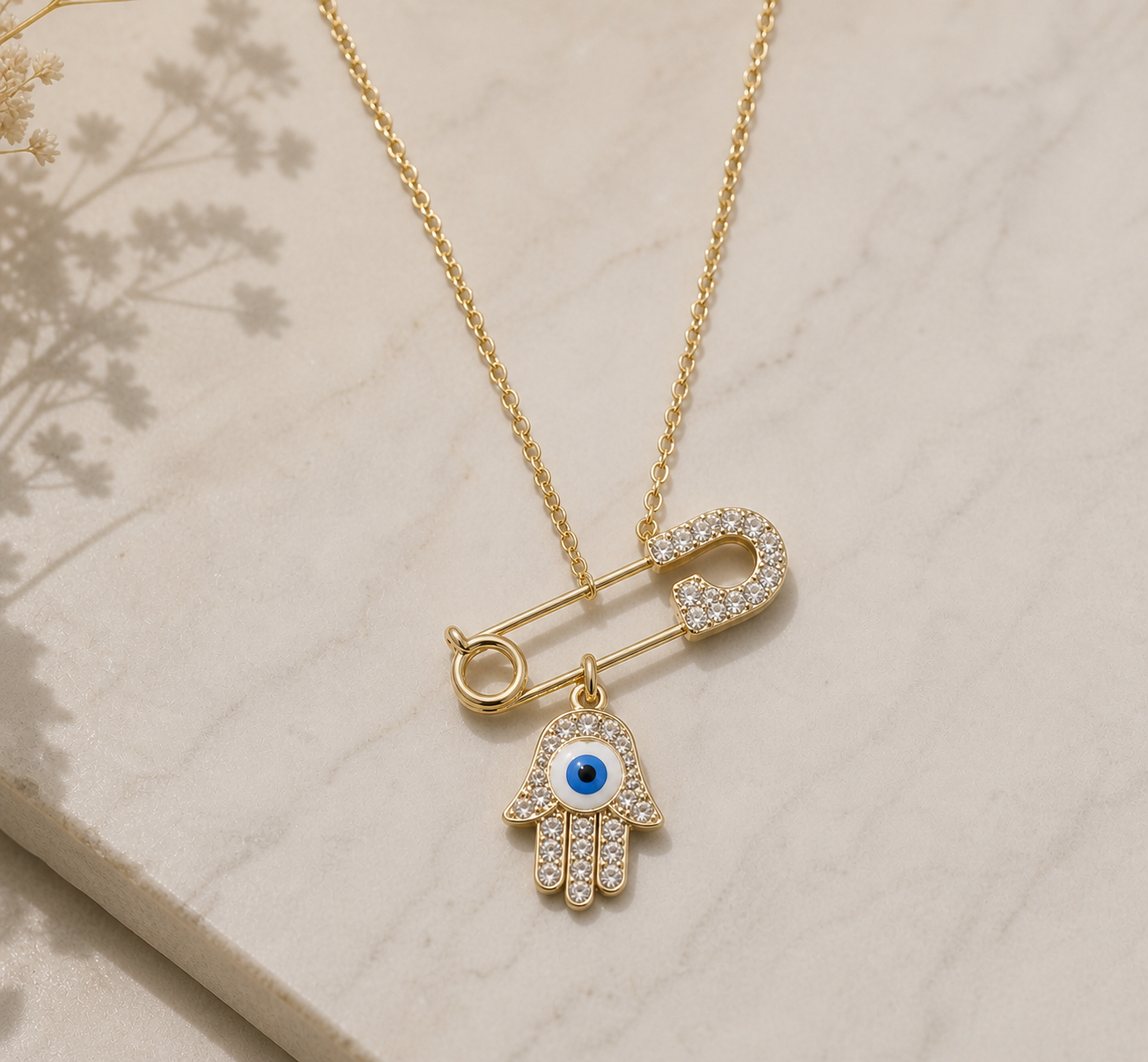 Ethereal Hamsa: Crystal-Encrusted Safety Pin & Evil Eye Pendant Necklace