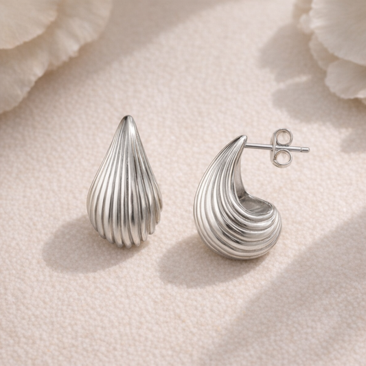 Coastal Radiance: Sculpted Shell-Inspired Drop Stud Earrings in Polished Silver-Tone